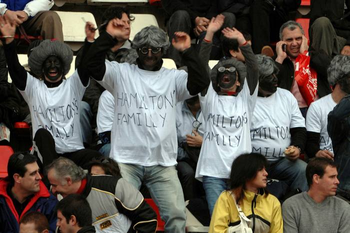 A group of F1 fans attracted a storm of controversy in 2008 by wearing black face paint and wigs at the Spanish Grand Prix in Barcelona