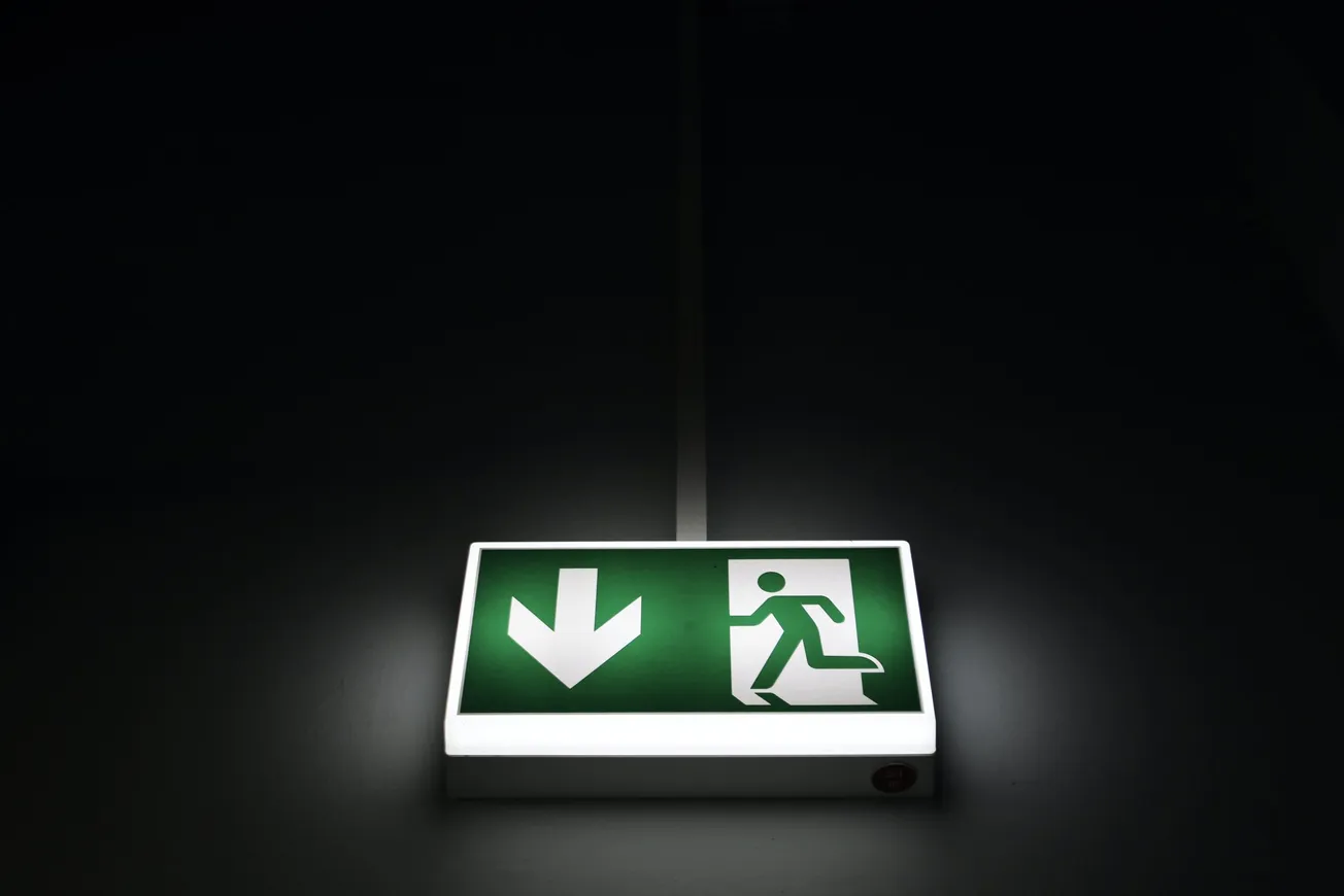 green and white exit sign