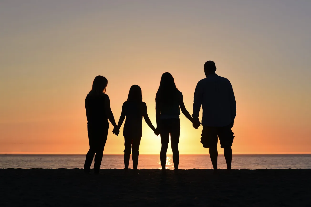 four people on seashore