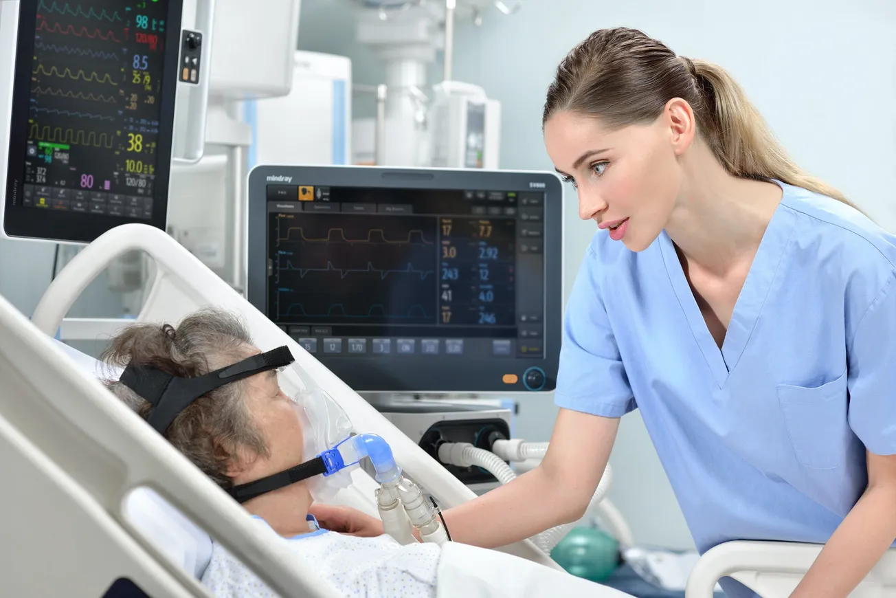 boy in blue scrub suit holding white printer paper