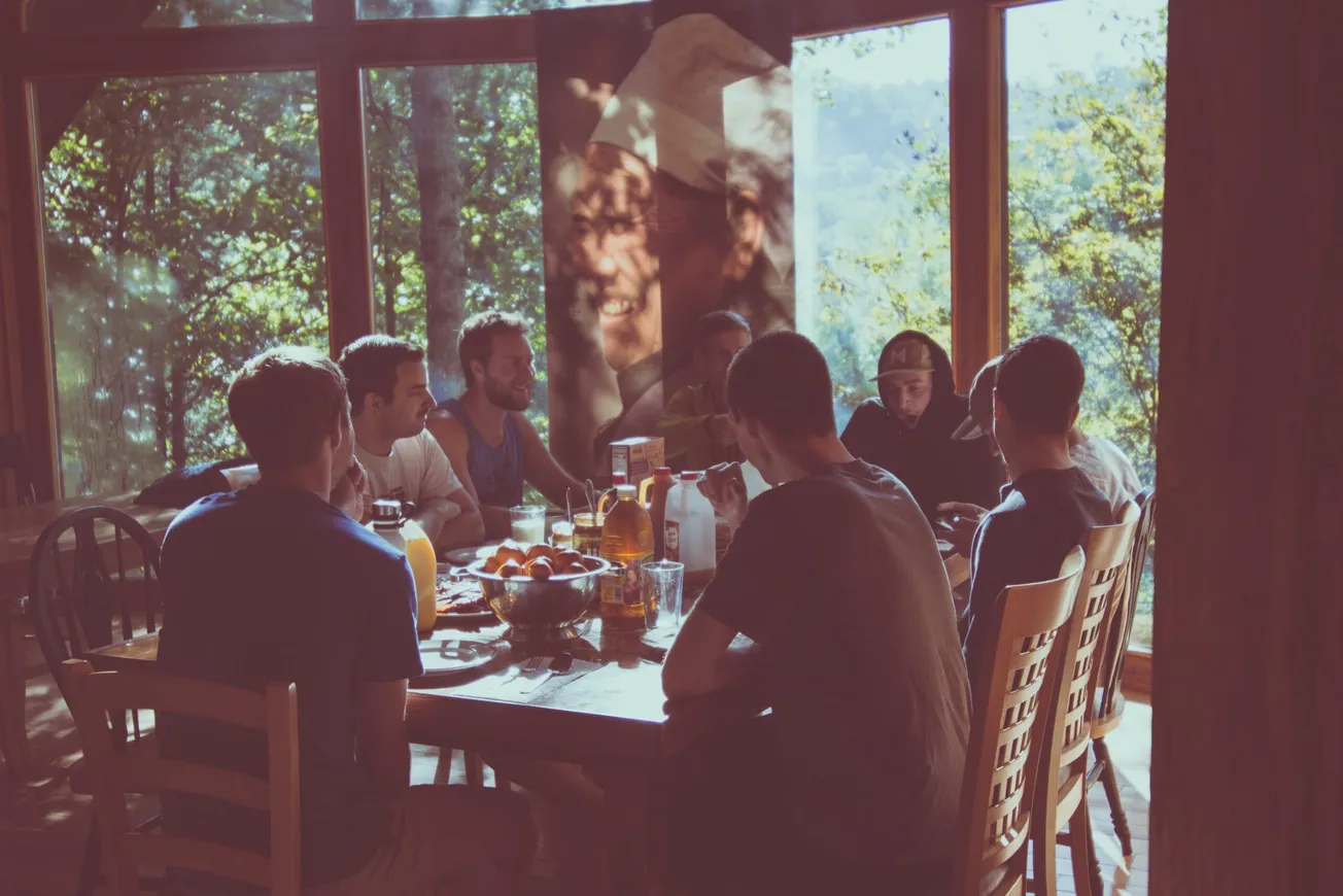 a group of people eating in a restaurant