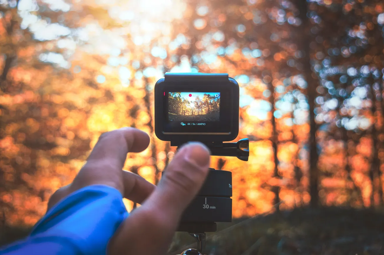 person holding activity camera