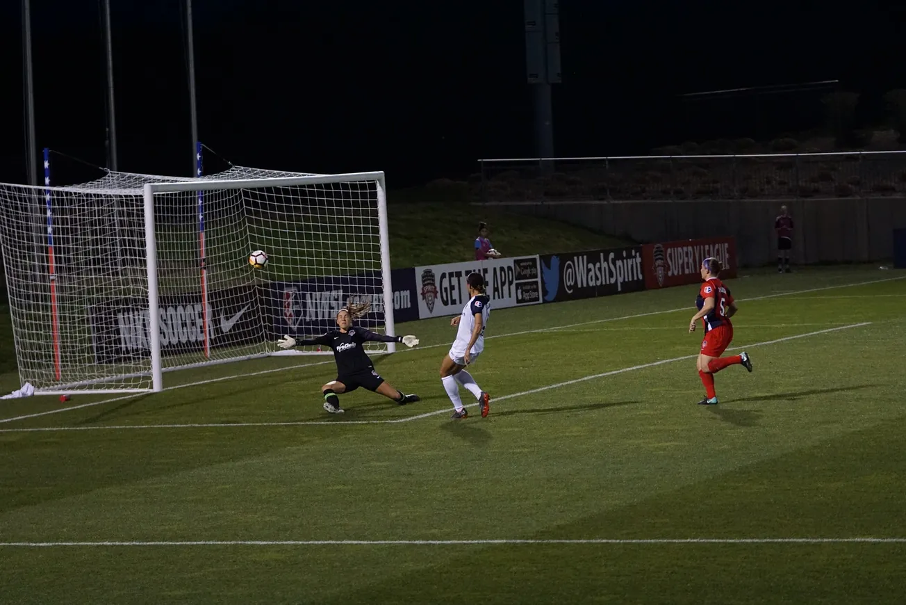 soccer player making goal