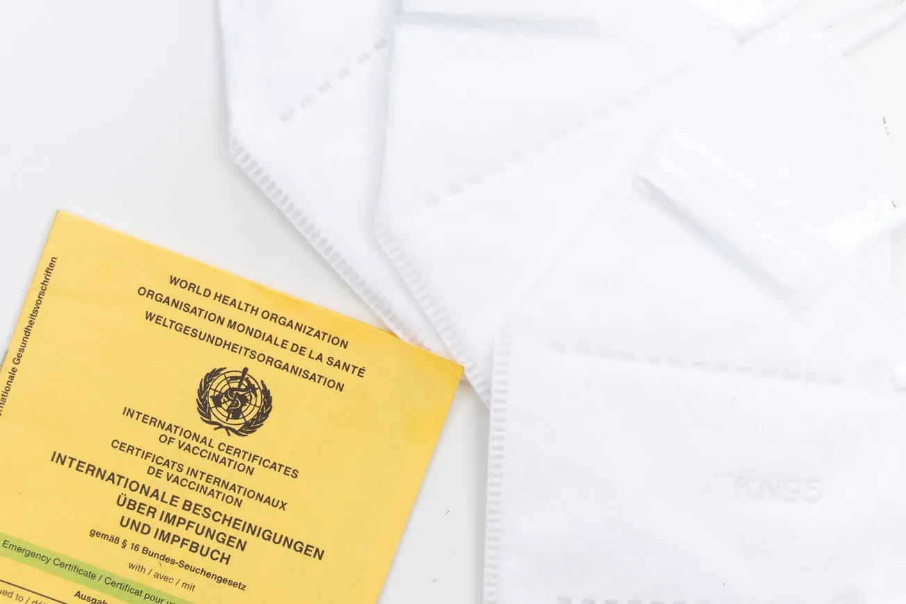 yellow and white book on white textile