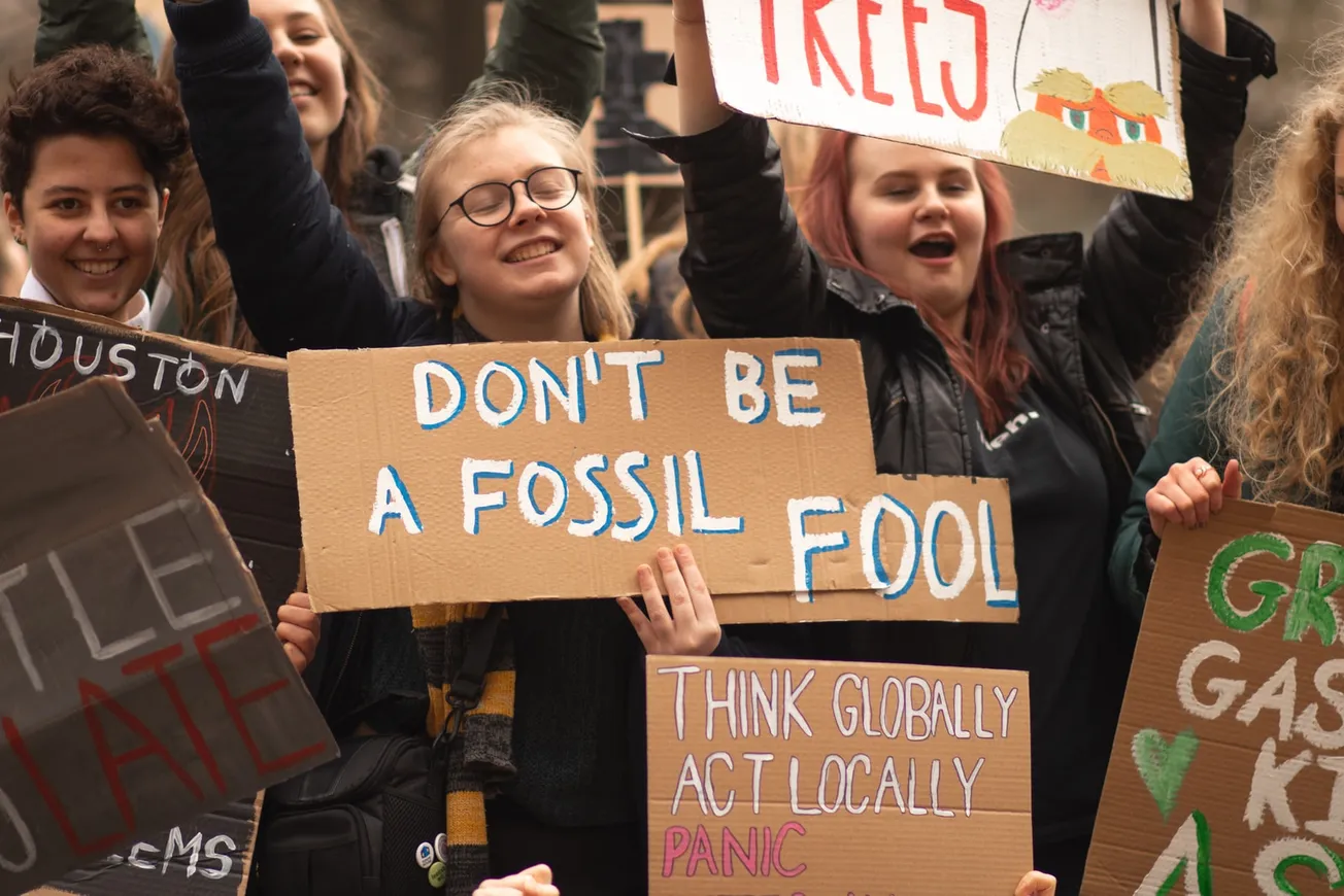 people holding signs