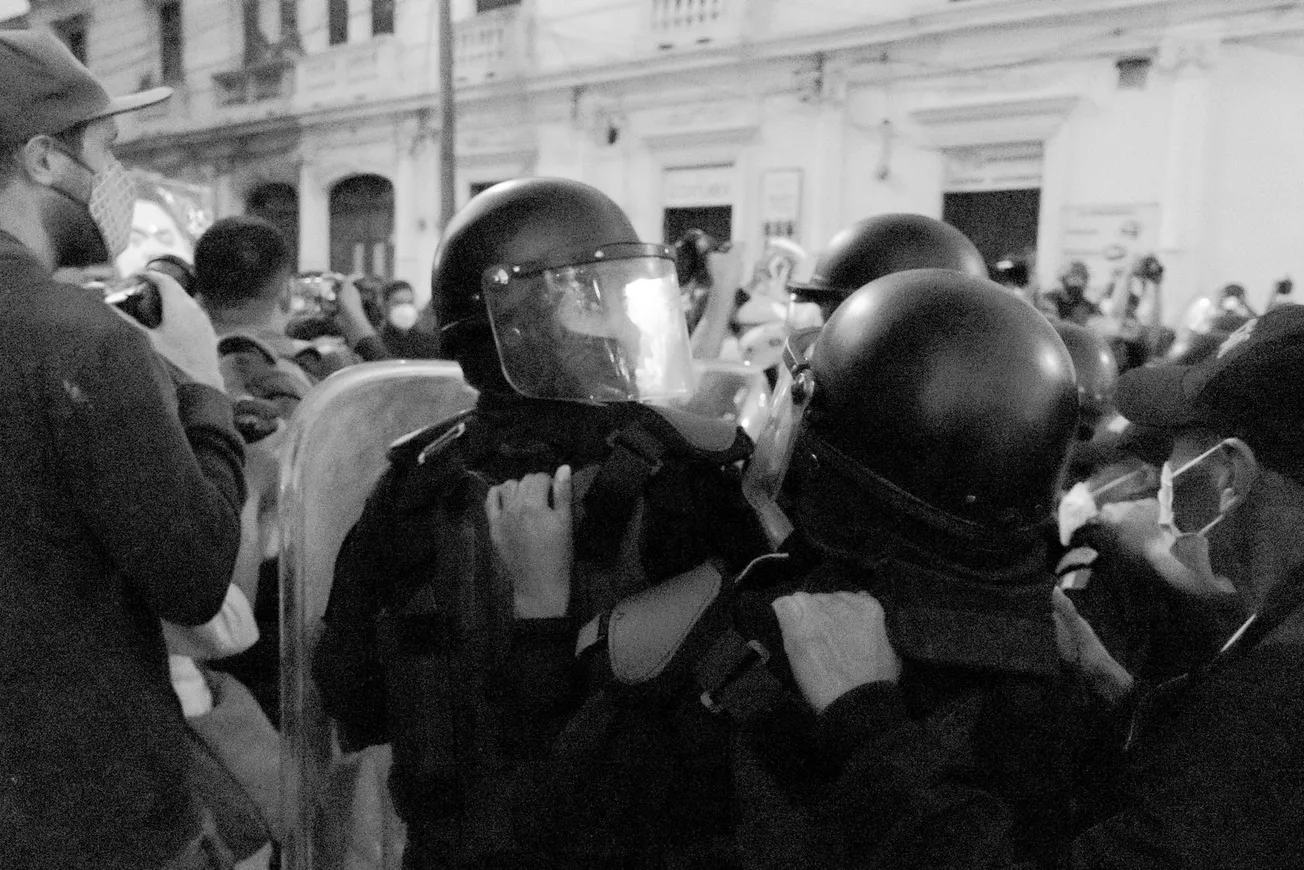 grayscale photo of man in black helmet