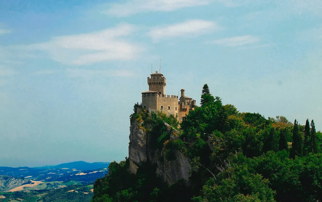 brown concrete castle on top of mountain