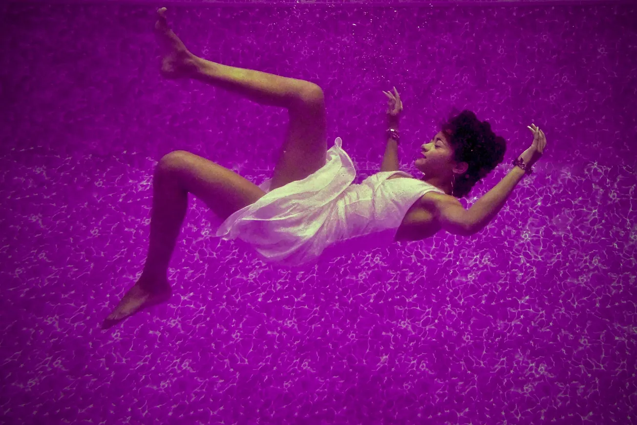 woman falls on purple surface