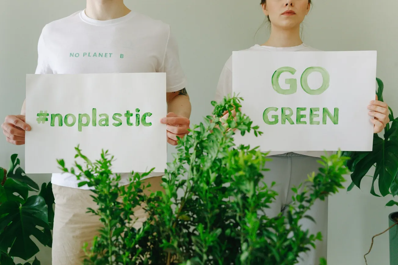 BFD People in White Shirt Holding Banners with Message About Nature Protection