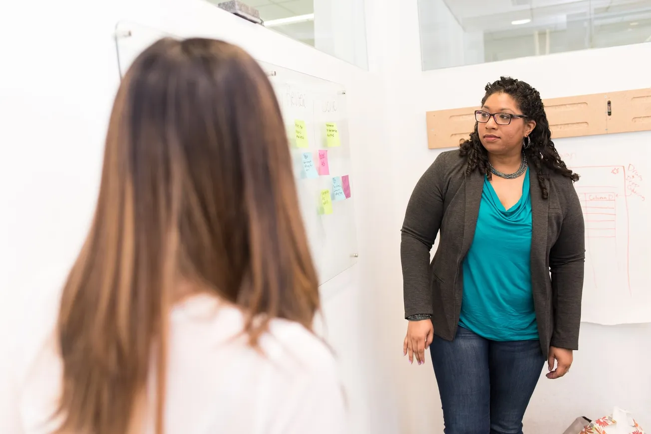 woman looking at whiteboard