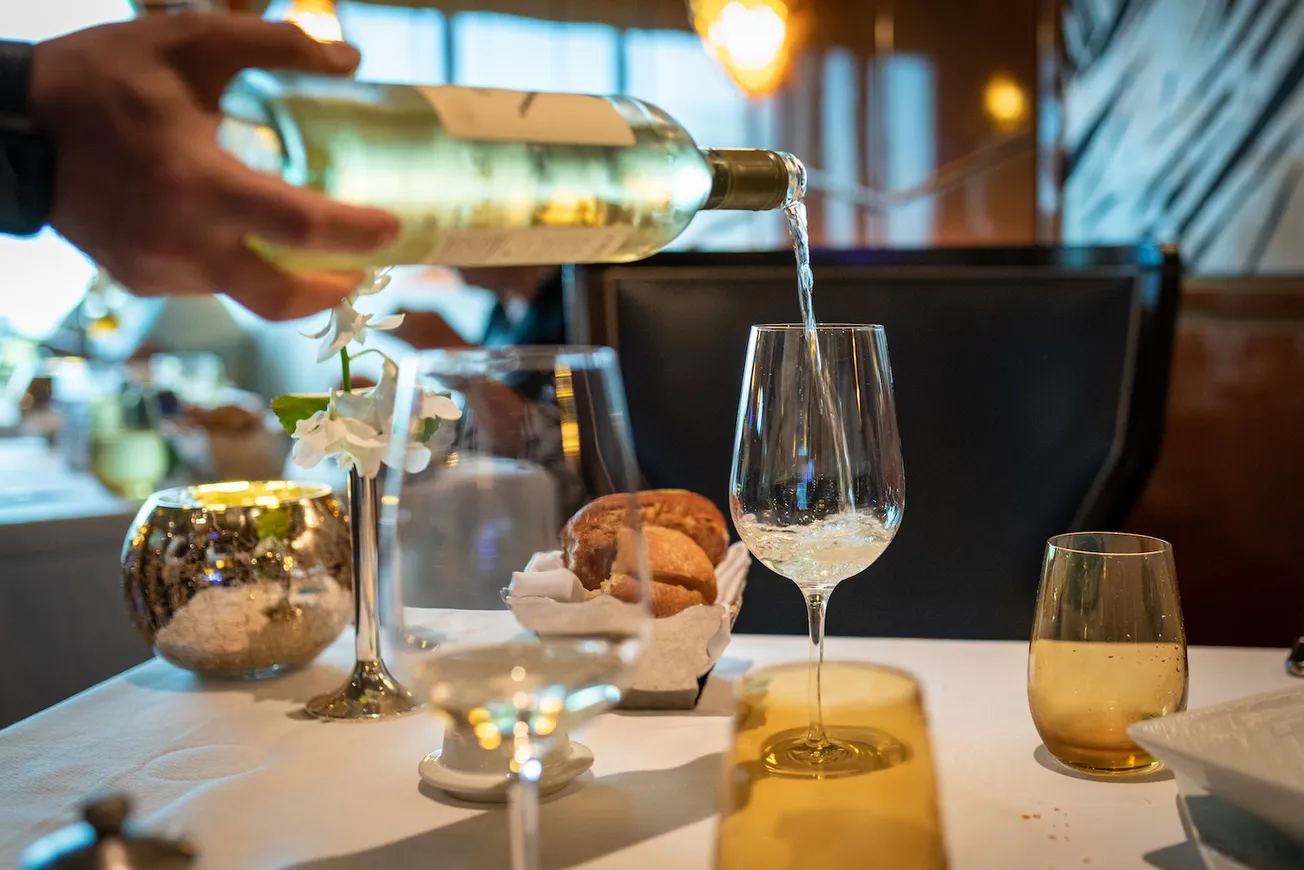 Wine Bottle Pouring on Wine Glass