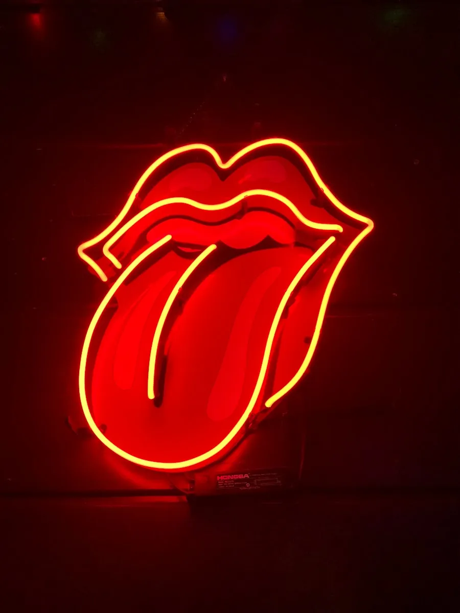 red tongue out neon light signage turned on