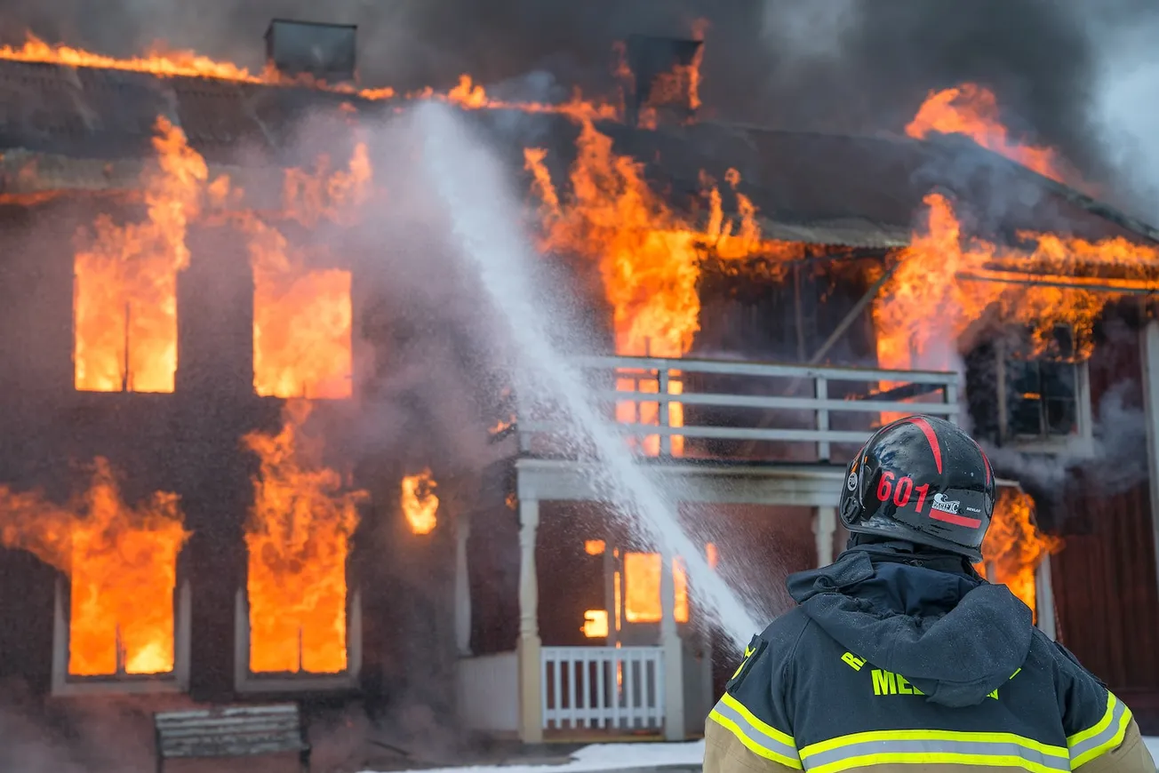 fireman watering fire