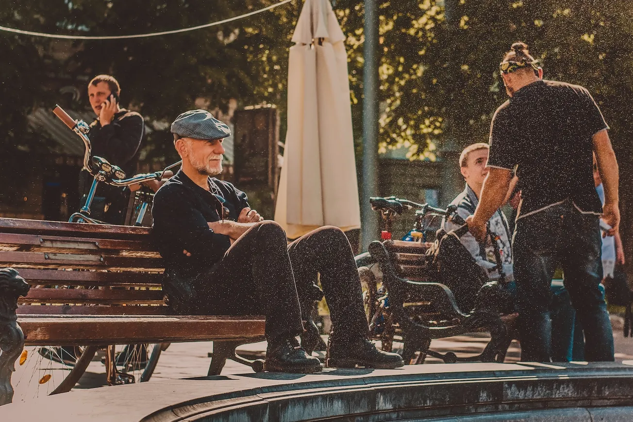 a group of people sitting on a bench