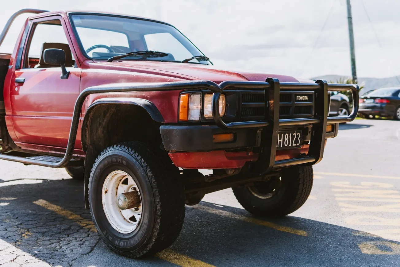 red chevrolet crew cab pickup truck