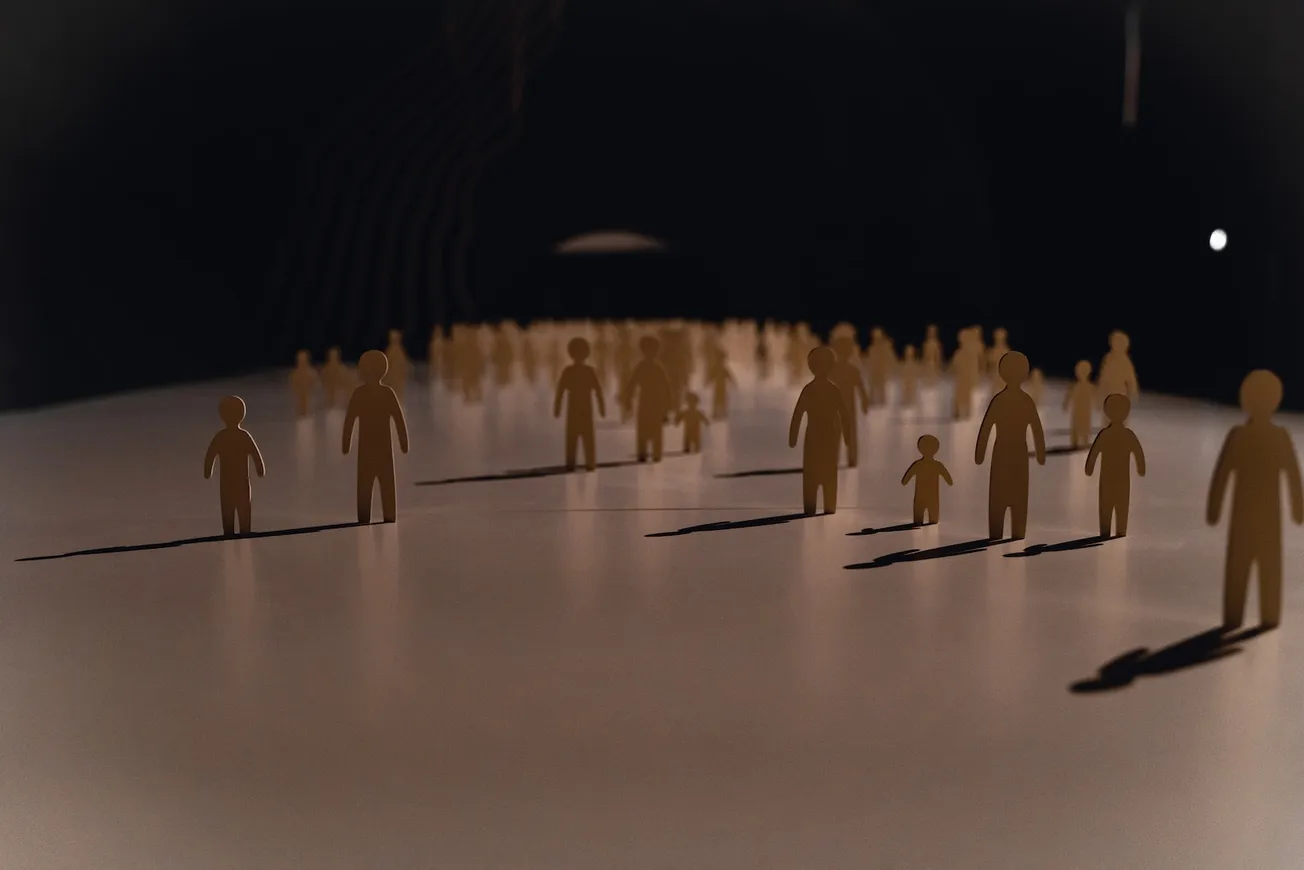 a group of paper people standing in a circle