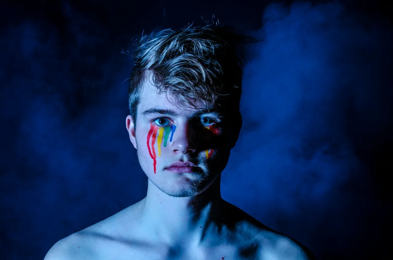 photo of man crying with colored tears