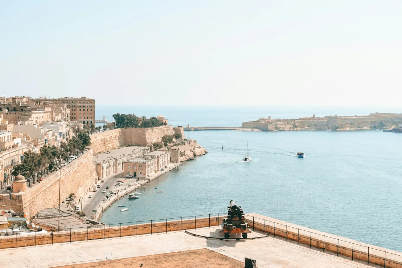 a large body of water next to a city