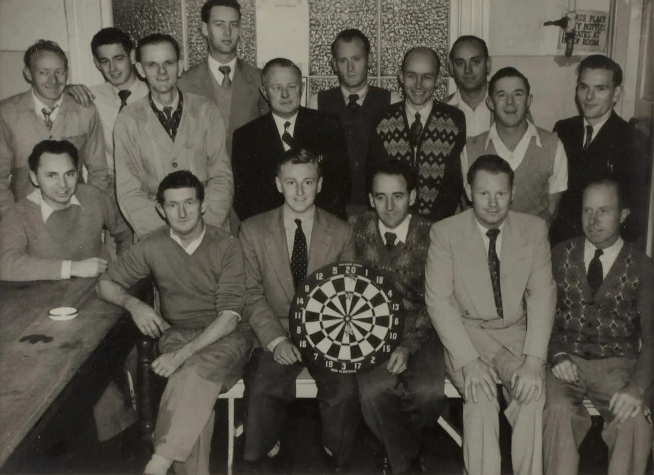 person holding dartboard