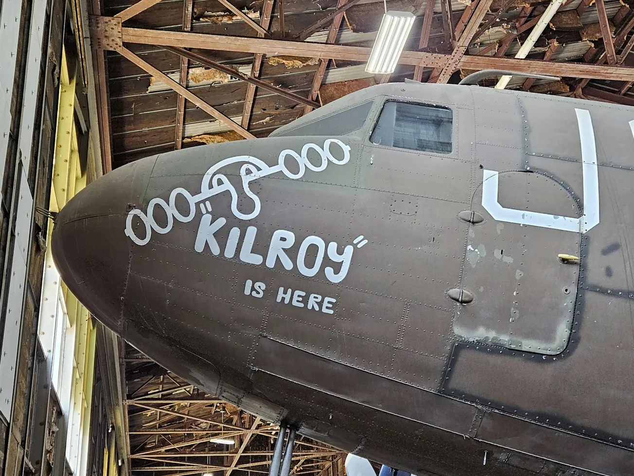 an old military plane is in a hangar