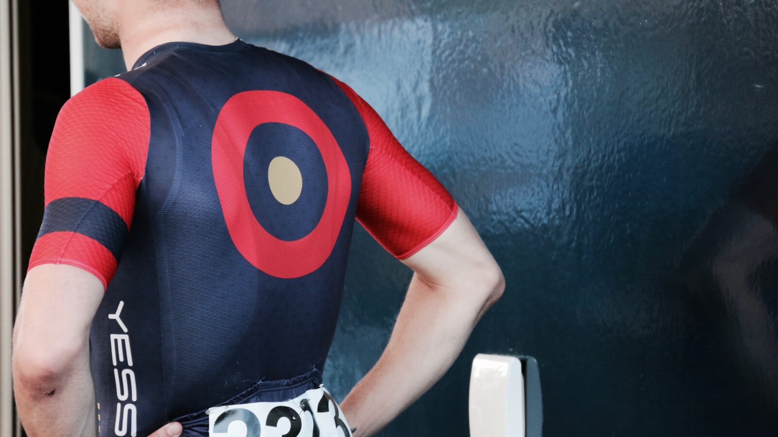 man wearing black and red cycling top