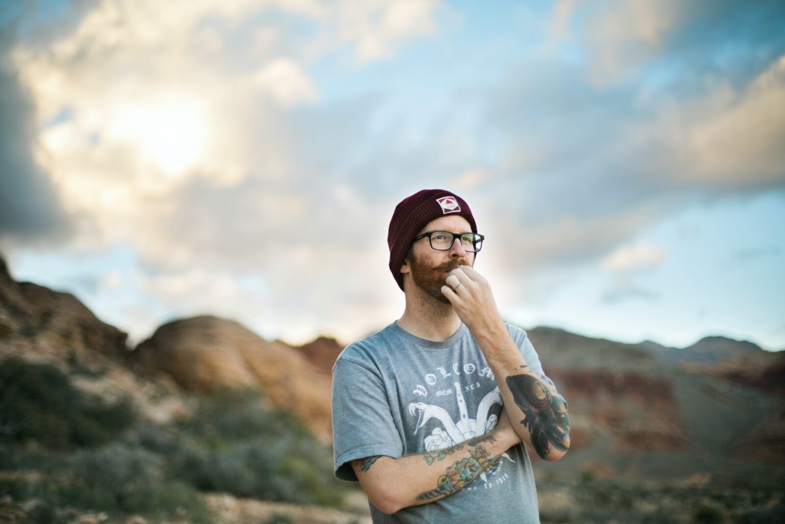 man in blue crew neck t-shirt wearing black sunglasses